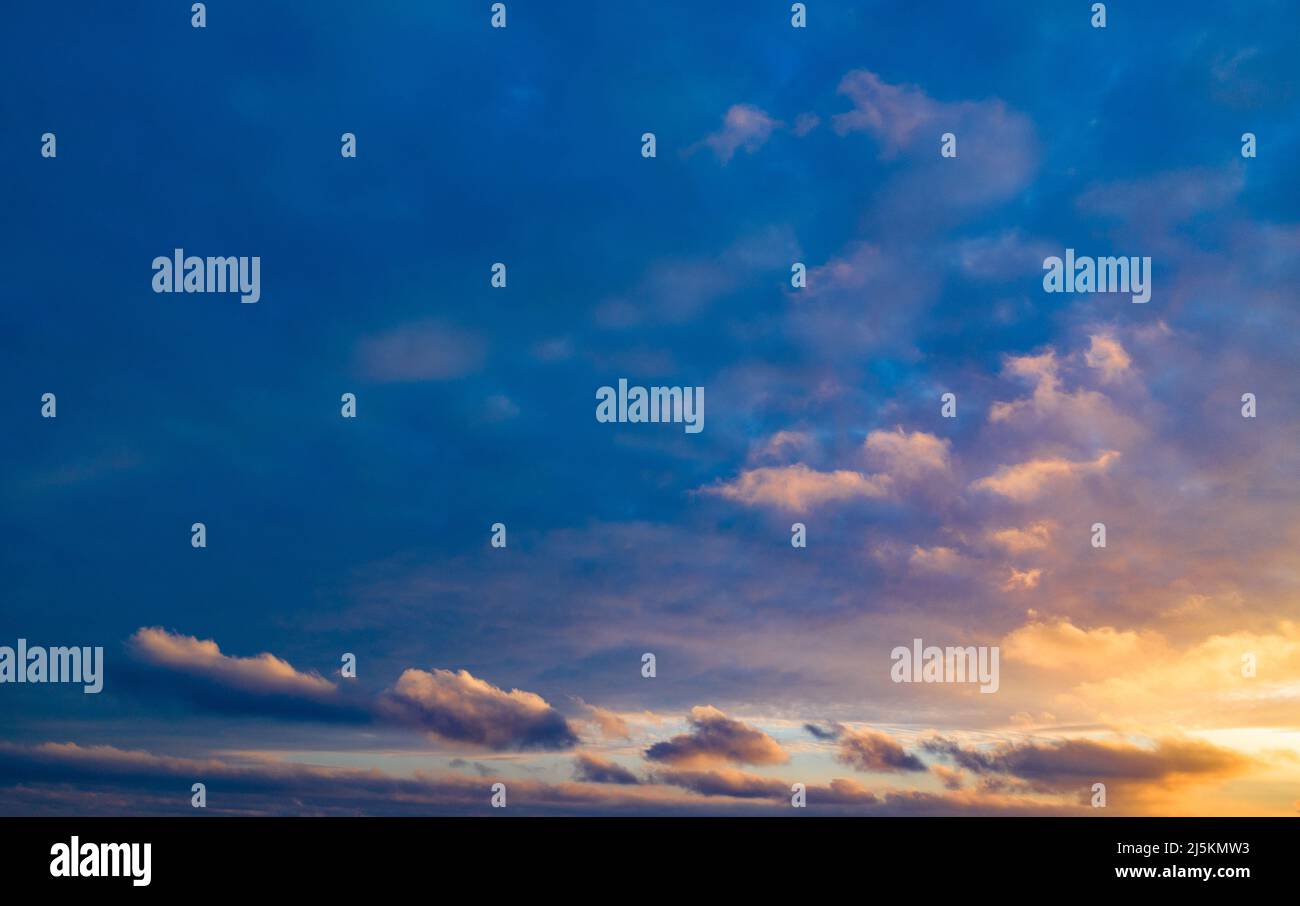 Scenic landscape of sunset sky with clouds above sea Stock Photo - Alamy