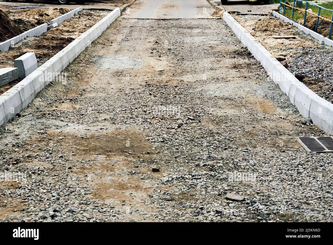 Roadbed with crushed stone gravel prepared for asphalt laying Stock