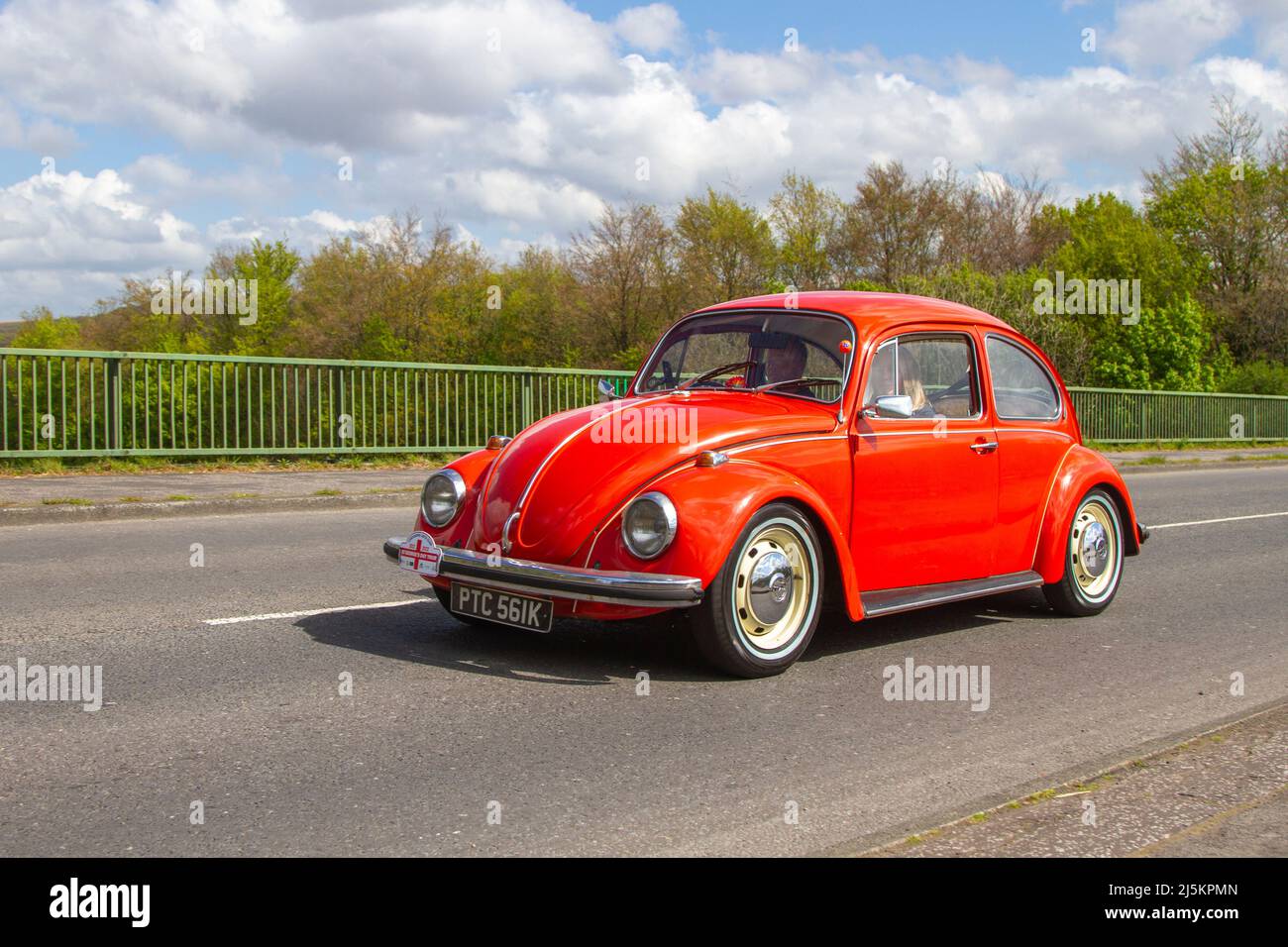 1972 70s seventies red VW Volkswagen Beetle 1285cc petrol Vee Dub; VW Beetles, old type, bug, Volkswagen Type 1, two-door, rear-engine subcompact economy car, Käfer, Vocho, Fusca, Cocinelle, Maggiolino, Punch Buggy, People’s Car, air-cooled, rear-engined, rear-wheel-drive compact car VW Beetles, old type bug driving near Manchester, UK Stock Photo