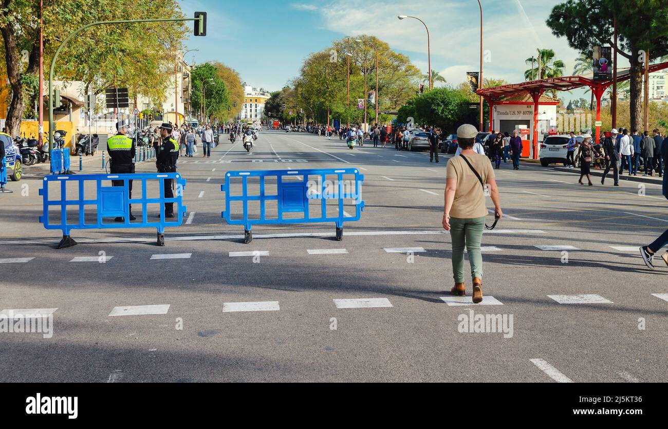 Street of the city during the Holy Week.  Police directing traffic. Stock Photo