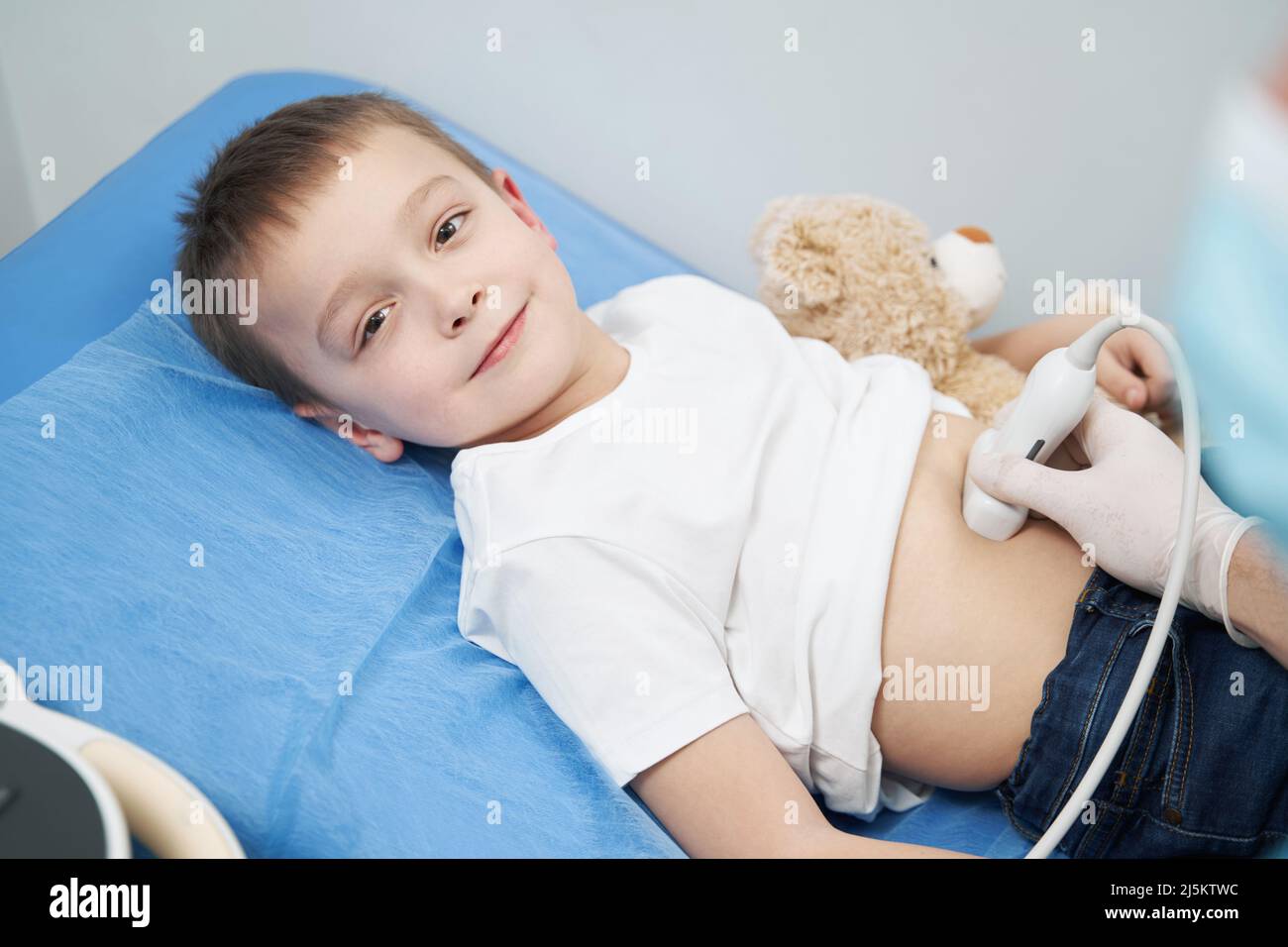 Little boy undergoing gastric and oesophageal ultrasound Stock Photo