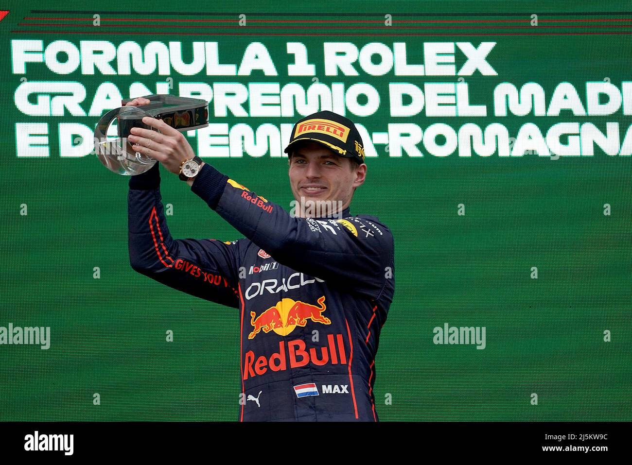 Miami Gardens, Florida, May 8, 2022. Dutch Formula One driver Max  Verstappen of Red Bull Racing holds a Miami Dolphins helmet signed by Dan  Marino and the first place trophy during the