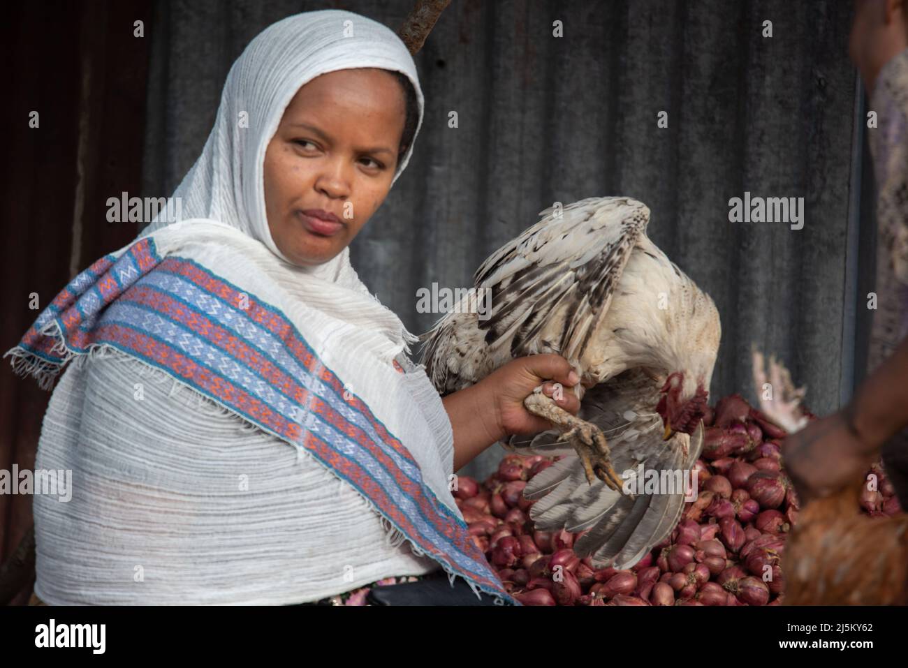 Addis Ababa, Ethiopia. 20th Apr, 2022. A customer buys chicken for