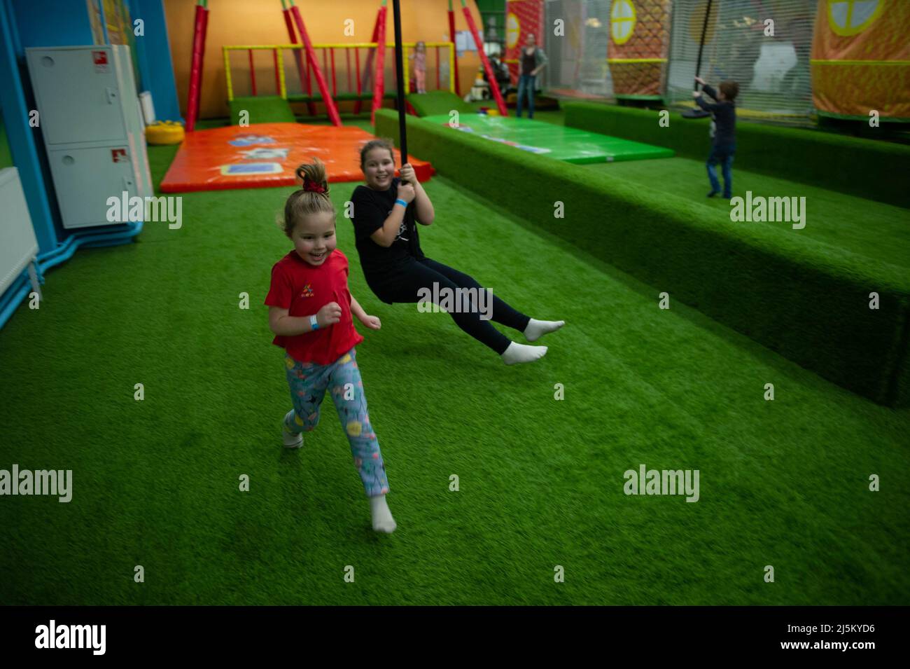 Children play a variety of games in fun room Stock Photo - Alamy