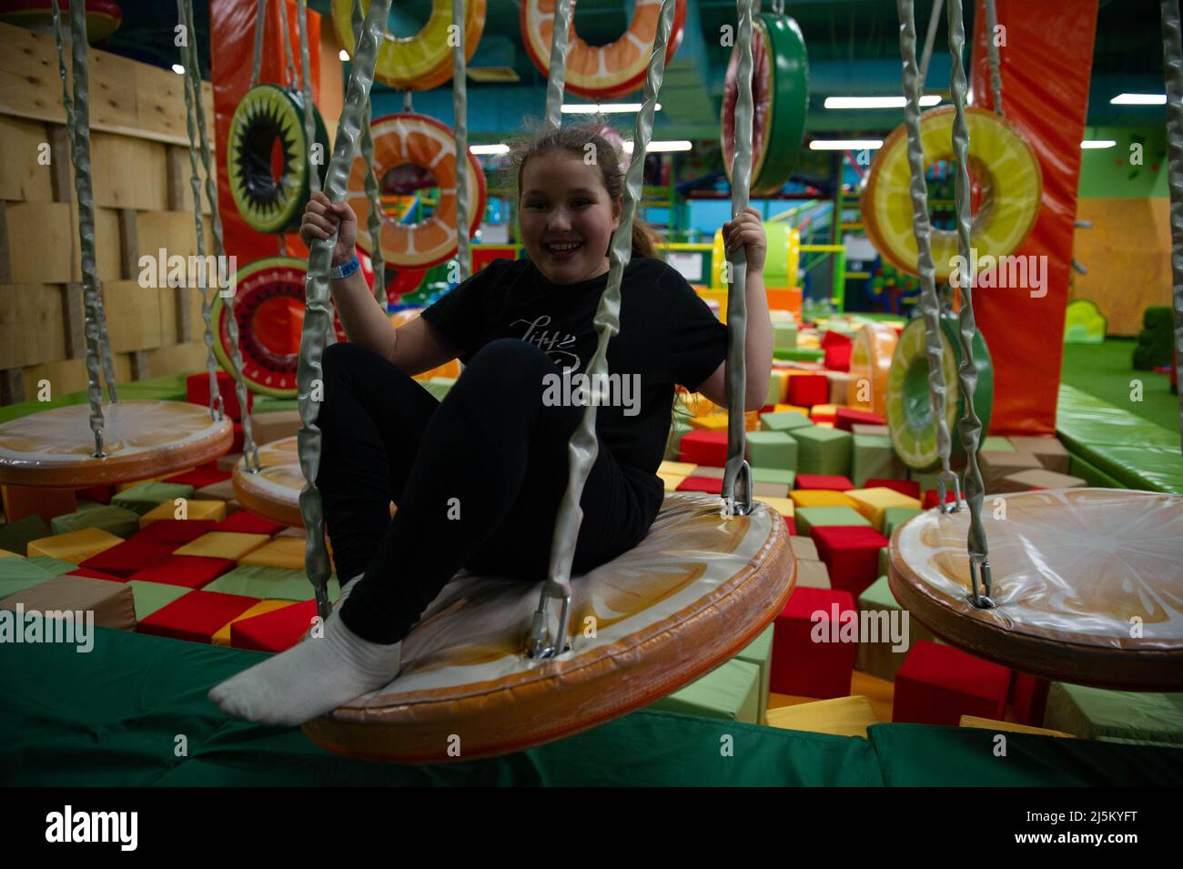 Children play a variety of games in fun room Stock Photo - Alamy