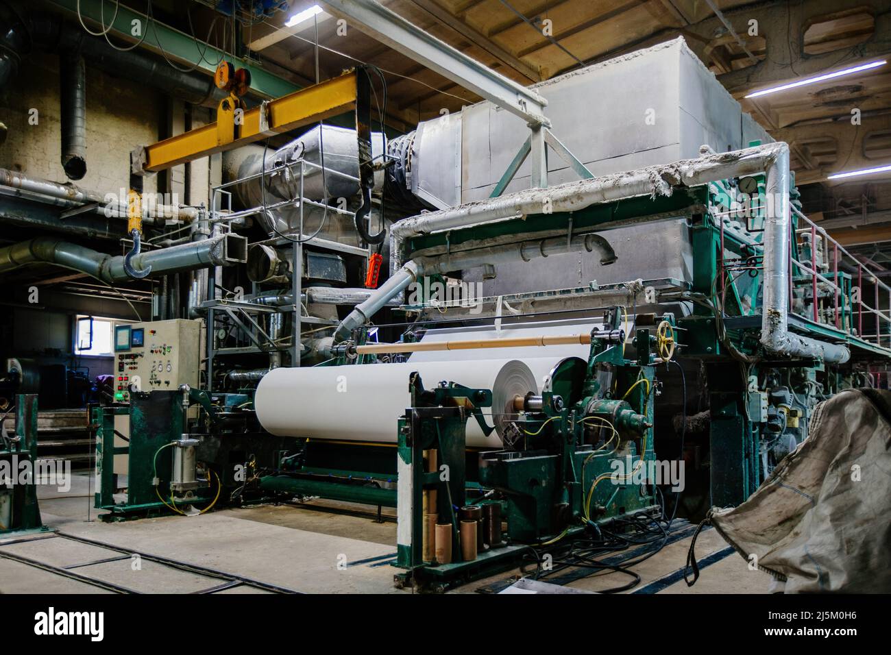 Waste paper recycling plant. Machine for production of paper rolls