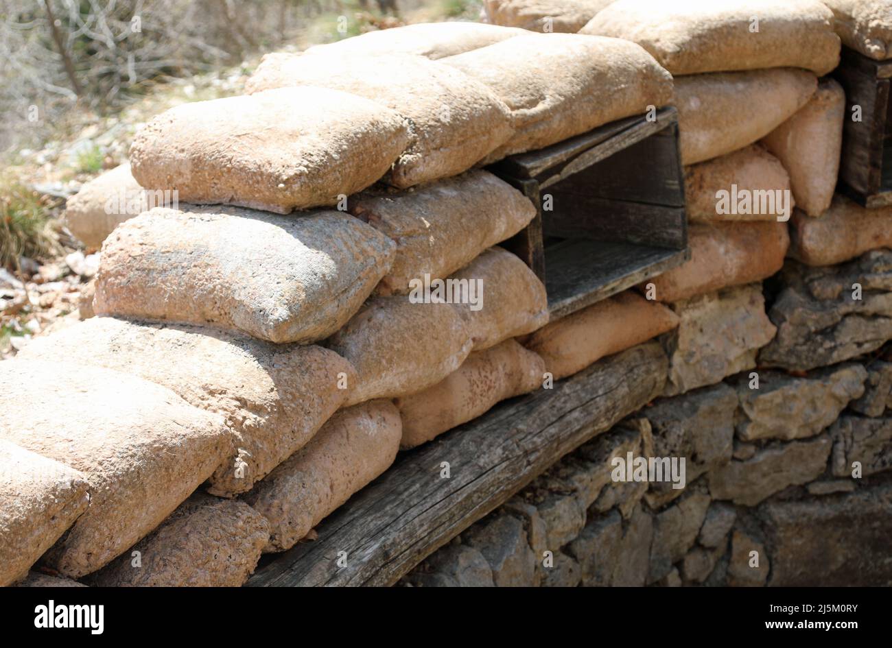 trench on the war front with the bags for the protection of the soldiers and the wounds for firing Stock Photo