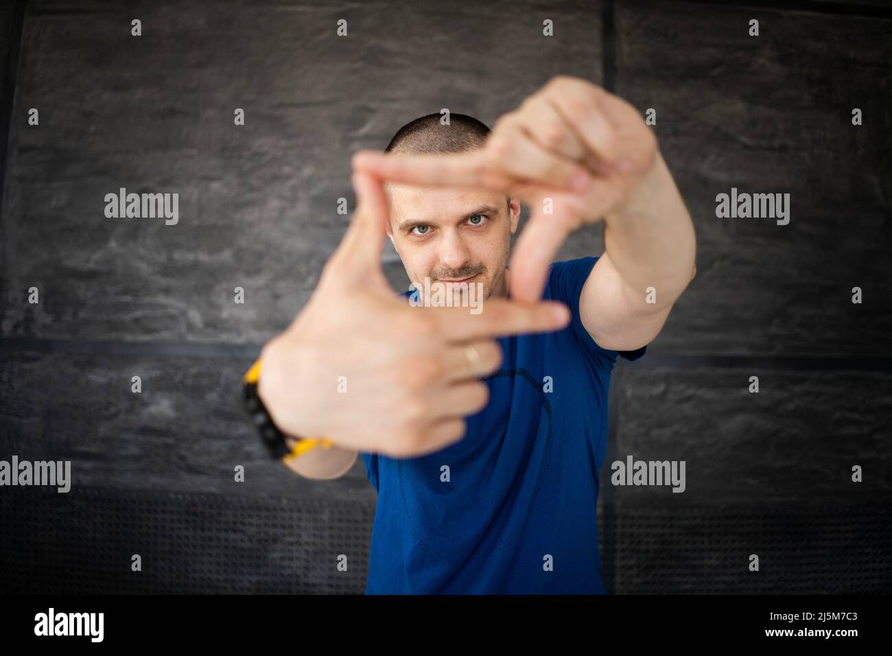 Portrait of adult man in blue t-shirt Stock Photo