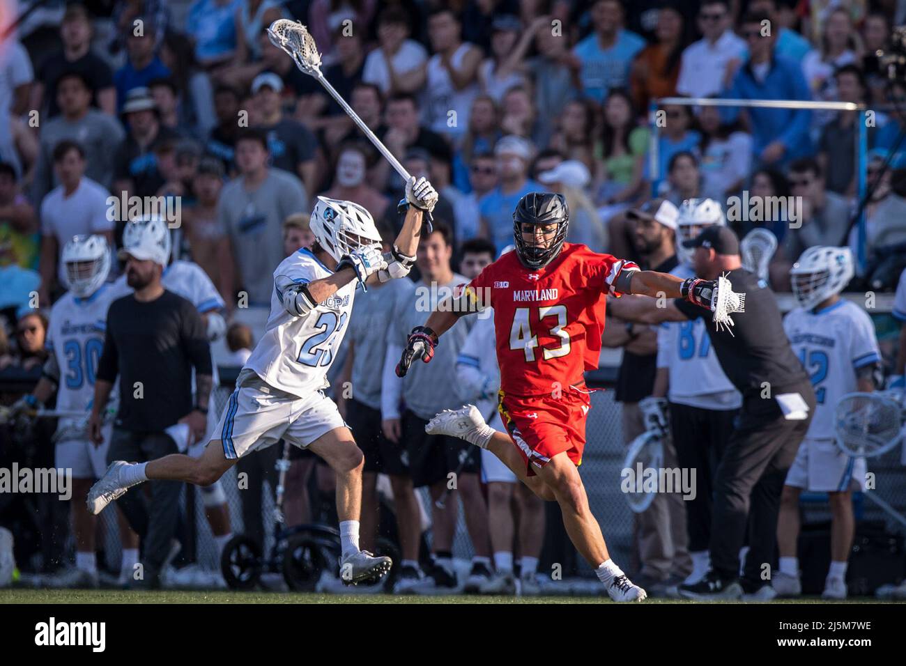 April 23, 2022: Maryland defender Brett Makar (43) brings the ball upfield with Johns Hopkins midfielder Jacob Angelus (23) on defense during the ncaa men's lacrosse regular season finale between the Maryland Terrapins and the Johns Hopkins Blue Jays at Homewood Field in Baltimore, Maryland Photographer: Cory Royster Stock Photo