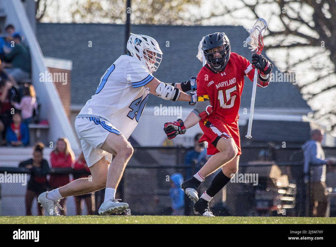 April 23, 2022: Johns Hopkins midfielder Garrett Degnon (40) lays the stick into Maryland attack Anthony DeMaio's (16) ribs behind the net during the ncaa men's lacrosse regular season finale between the Maryland Terrapins and the Johns Hopkins Blue Jays at Homewood Field in Baltimore, Maryland Photographer: Cory Royster Stock Photo