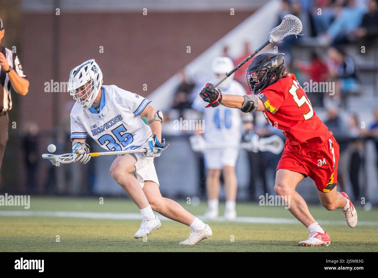 April 23, 2022: Maryland midfielder Jack Brennan (41) attacks the net and scores with Johns Hopkins defender/midfielder Brett Martin (12) on defense during the ncaa men's lacrosse regular season finale between the Maryland Terrapins and the Johns Hopkins Blue Jays at Homewood Field in Baltimore, Maryland Photographer: Cory Royster Stock Photo