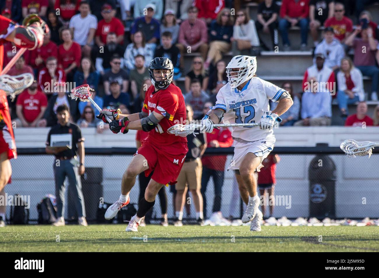 April 23, 2022: Maryland midfielder Jack Brennan (41) attacks the net and scores with Johns Hopkins defender/midfielder Brett Martin (12) on defense during the ncaa men's lacrosse regular season finale between the Maryland Terrapins and the Johns Hopkins Blue Jays at Homewood Field in Baltimore, Maryland Photographer: Cory Royster Stock Photo