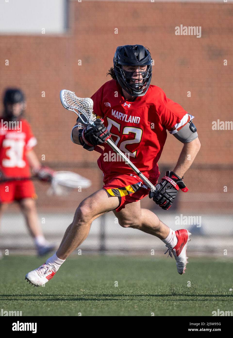April 23, 2022: Maryland faceoff specialist Luke Wierman (52) wins the opening faceoff during the ncaa men's lacrosse regular season finale between the Maryland Terrapins and the Johns Hopkins Blue Jays at Homewood Field in Baltimore, Maryland Photographer: Cory Royster Stock Photo