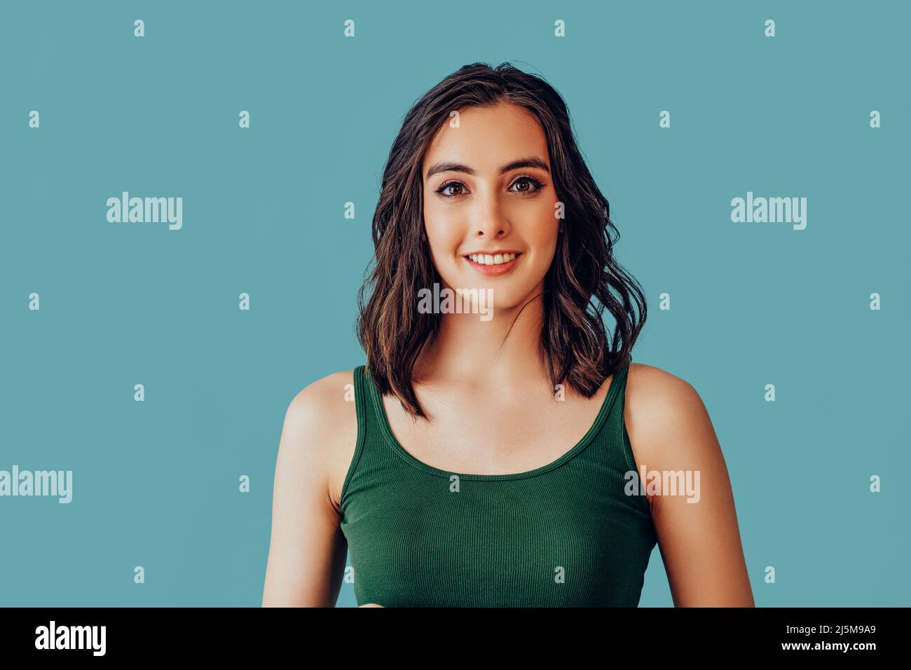 woman looking at camera with a pleasant smile studio portrait Stock ...