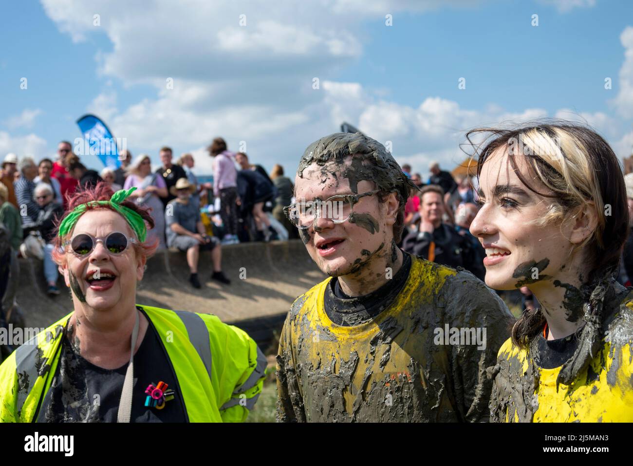 Jo Brand, joined with Alfie Richer and Maisi Bourke (daughter of Jo Brand), after they completed the Maldon Mud Race, Essex, UK. Covered in mud Stock Photo