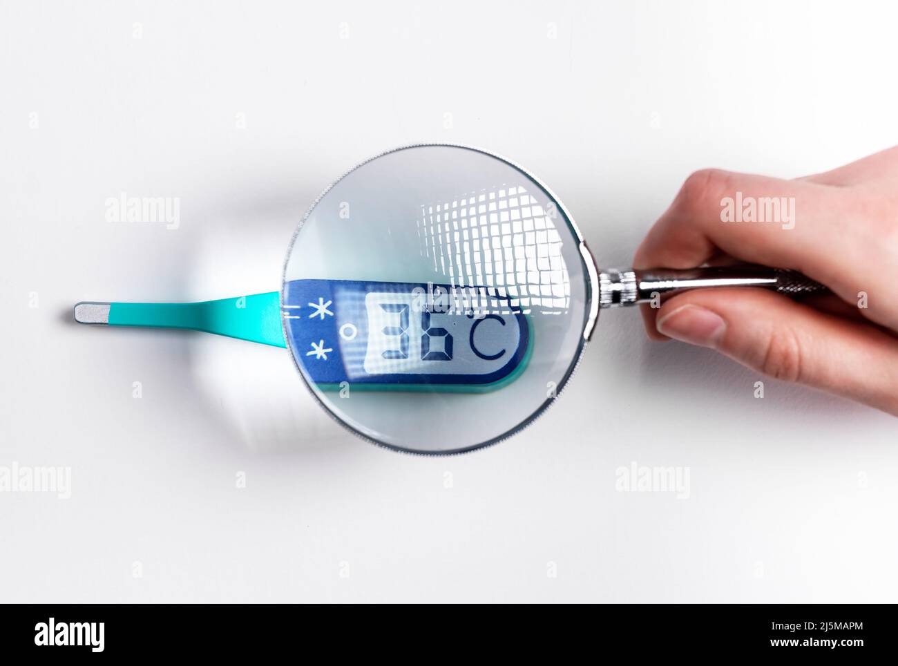Magnifier and contact thermometer layout showing normal temperature