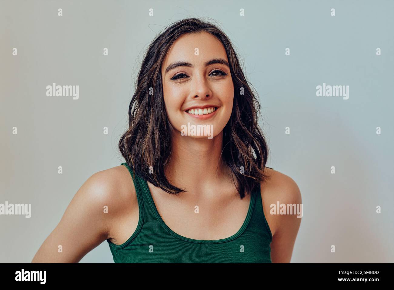 Closeup beautiful woman smiling at camera studio portrait Stock Photo ...