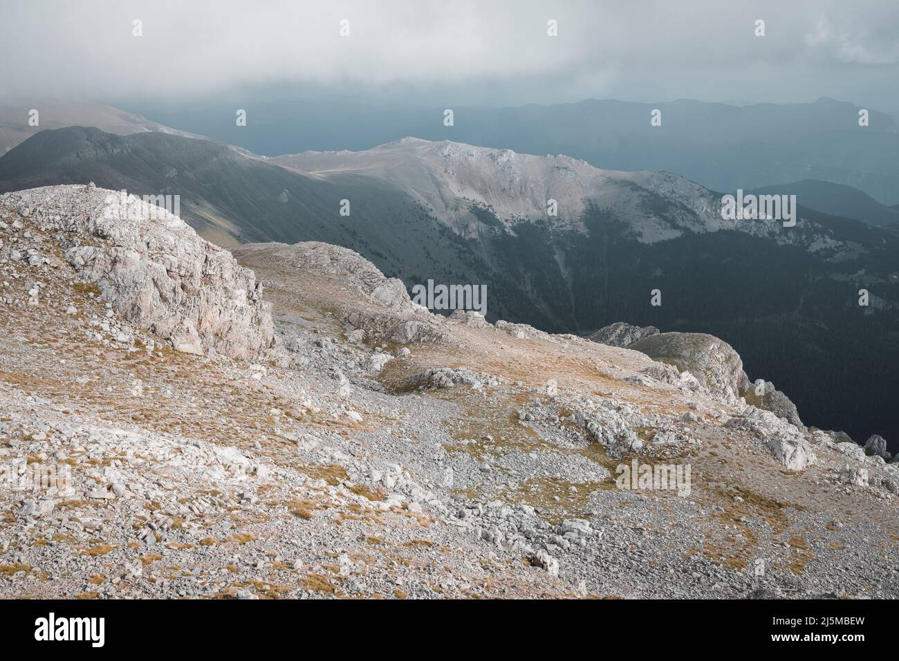Rocky surroundings of the summit of Tosa d'Alp or La Tosa with Puigllançada in the background. Catalonia. Spain. Stock Photo
