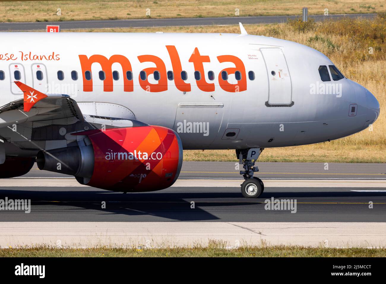 Air Malta Airbus A320-214 (REG: 9H-AEP) lining up for take runway 31 abeam taxiway Charlie. Stock Photo