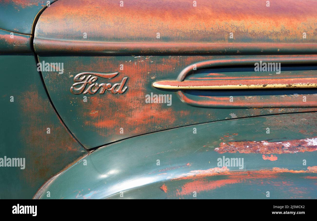 Close up of Vintage truck bonnet with rustic paint and ford logo. Stock Photo