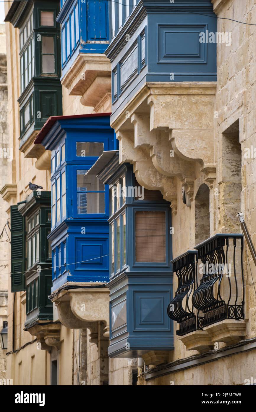 Typical colorful balconies in the historic center of La Valletta Stock Photo