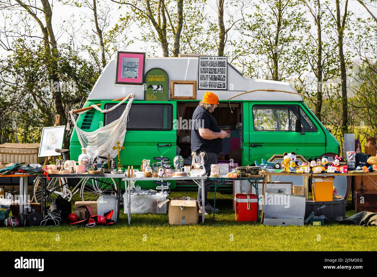 Saturday car boot sale, this stall holder all set up and ready for business  offering a large selection of secondhand items ,curios, glassware. Stock Photo