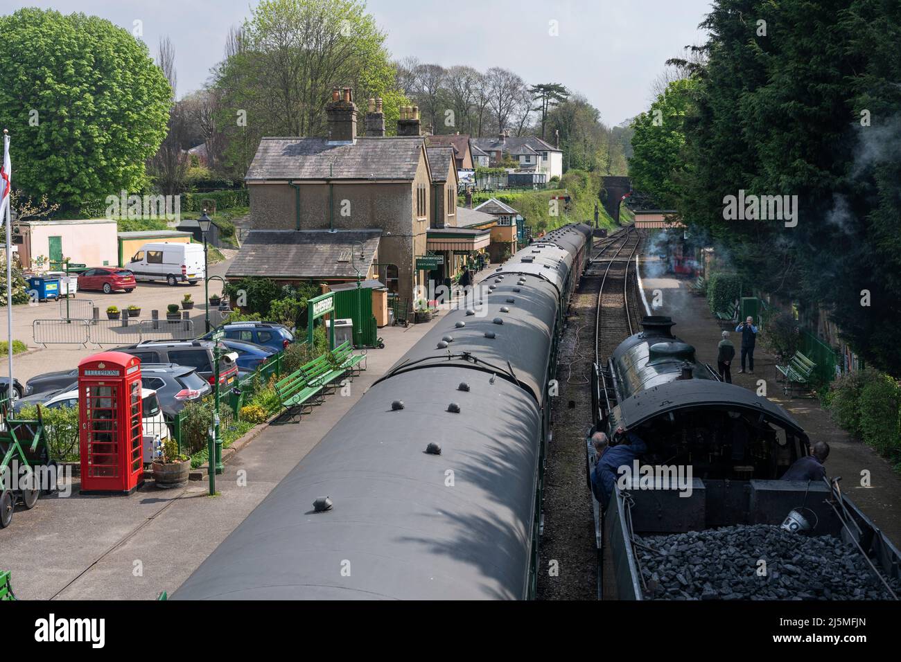 30925 steam locomotive moving to the front of the train at Alresford train station. The mid-hants heritage Watercress Line. Hampshire, England Stock Photo