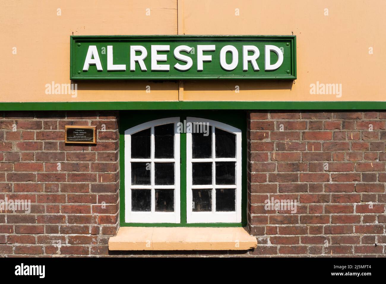 Traditional railway sign in Gill Sans typeface in British Railways green at Alresford train station on the heritage Watercress Line. Hampshire. UK Stock Photo