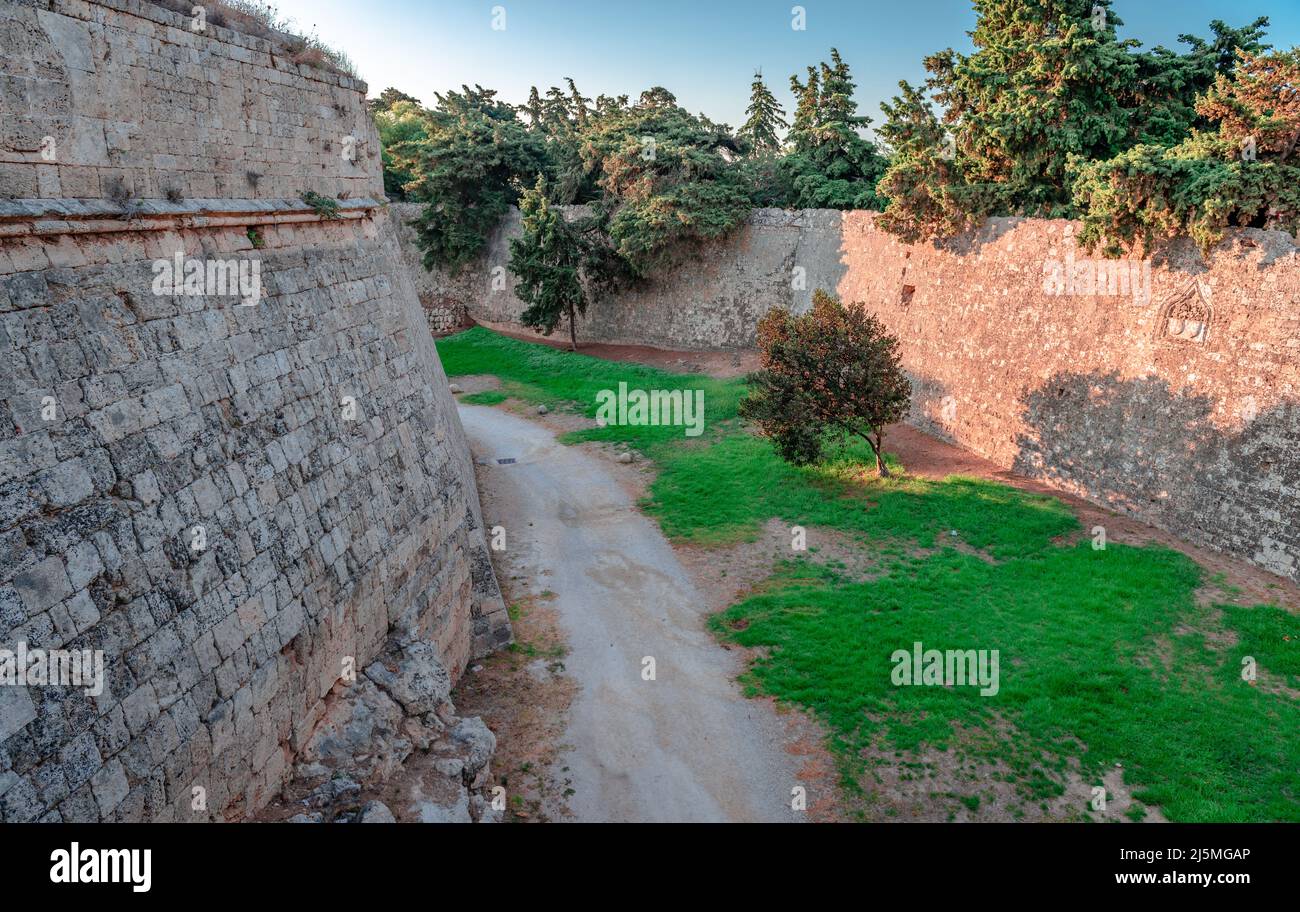 View of the medieval moat that surrounds the medieval city of Rhodes, Dodecanese, Greece. Stock Photo