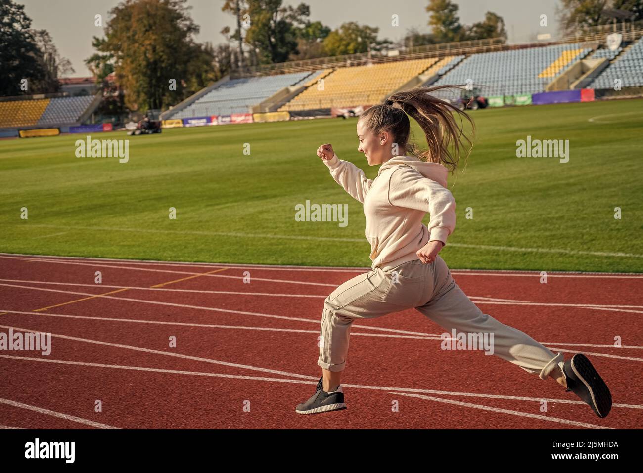 The rule in running is just run. Energetic girl run on running track