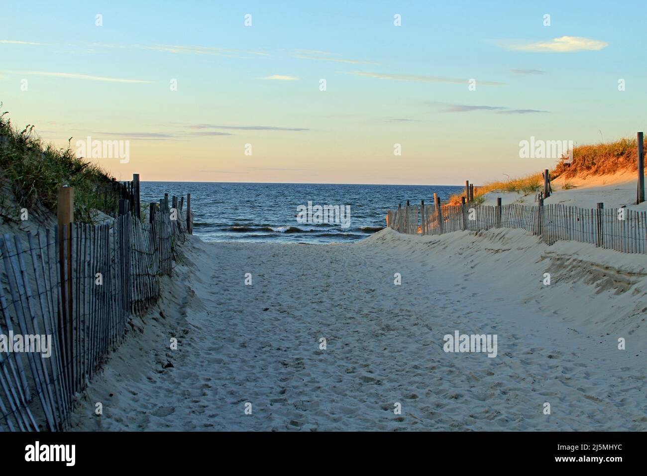 Sunset highlighting dunes along the sandy entrance to Cold Storage