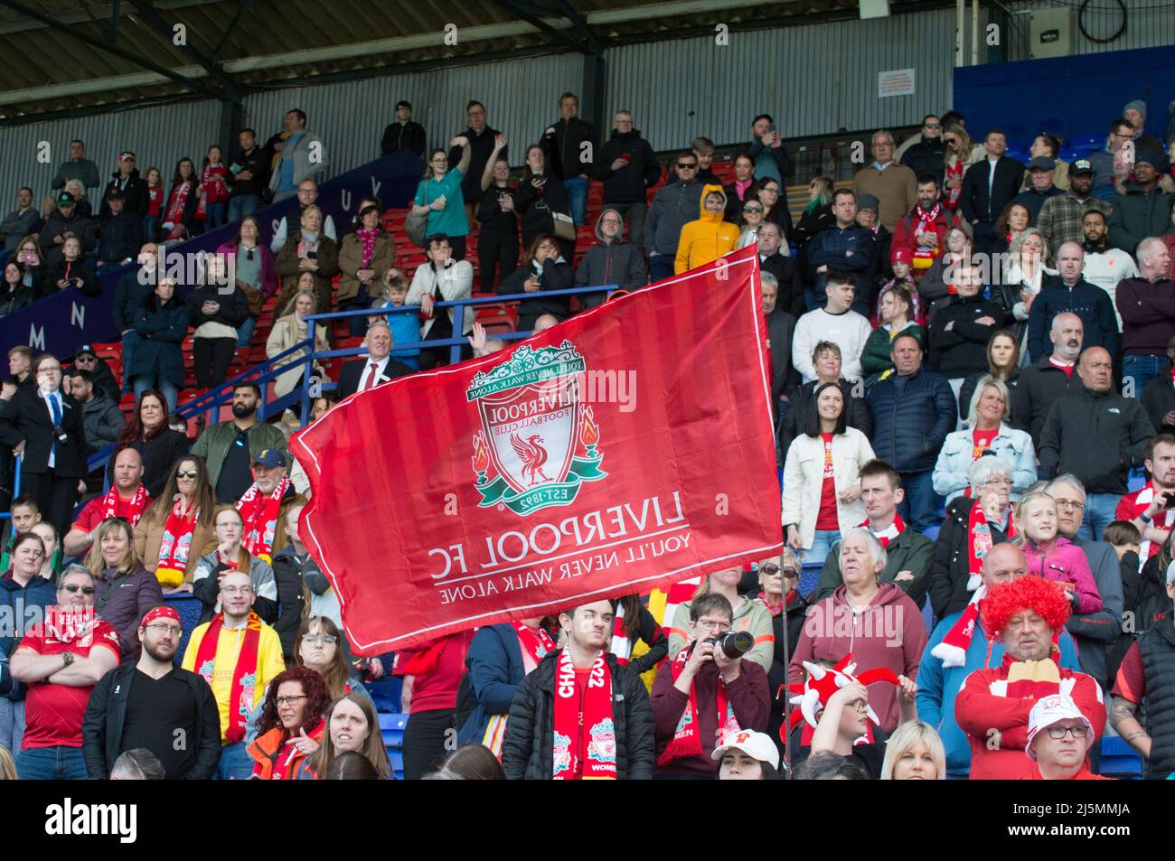 Birkenhead, UK. 24th Apr, 2022. Liverpool fans celebrate after beating Sheffield United 6-1 during the Womens Championship football match between Liverpool and Sheffield United at Prenton Park in Birkenhead, England. Terry Scott/SPP Credit: SPP Sport Press Photo. /Alamy Live News Stock Photo