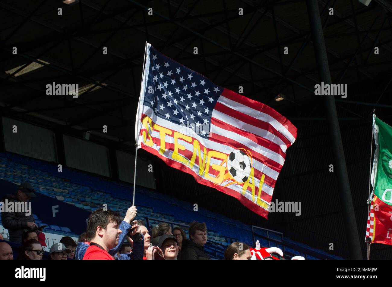 Birkenhead, UK. 24th Apr, 2022. Liverpool fans with flag during the Womens Championship football match between Liverpool and Sheffield United at Prenton Park in Birkenhead, England. Terry Scott/SPP Credit: SPP Sport Press Photo. /Alamy Live News Stock Photo