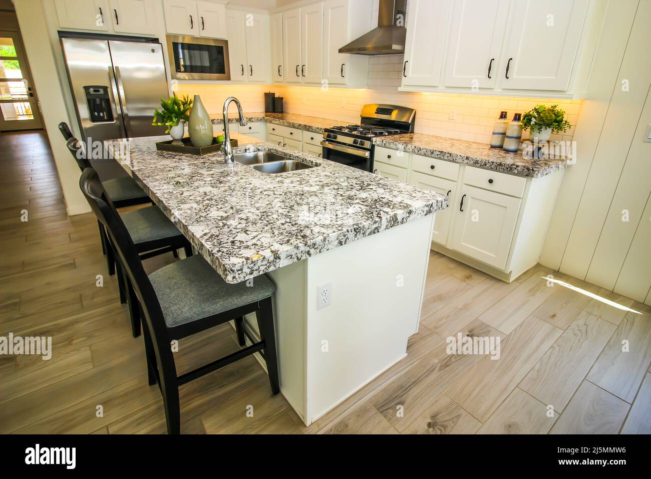 Kitchen Island Granite Counter Top And Bar Stools Stock Photo Alamy