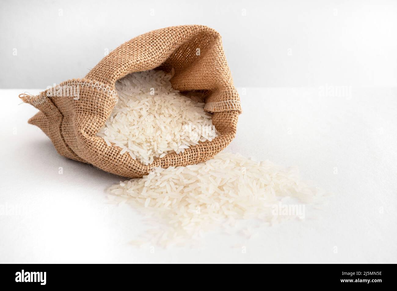 White rice in a hessian bag Stock Photo