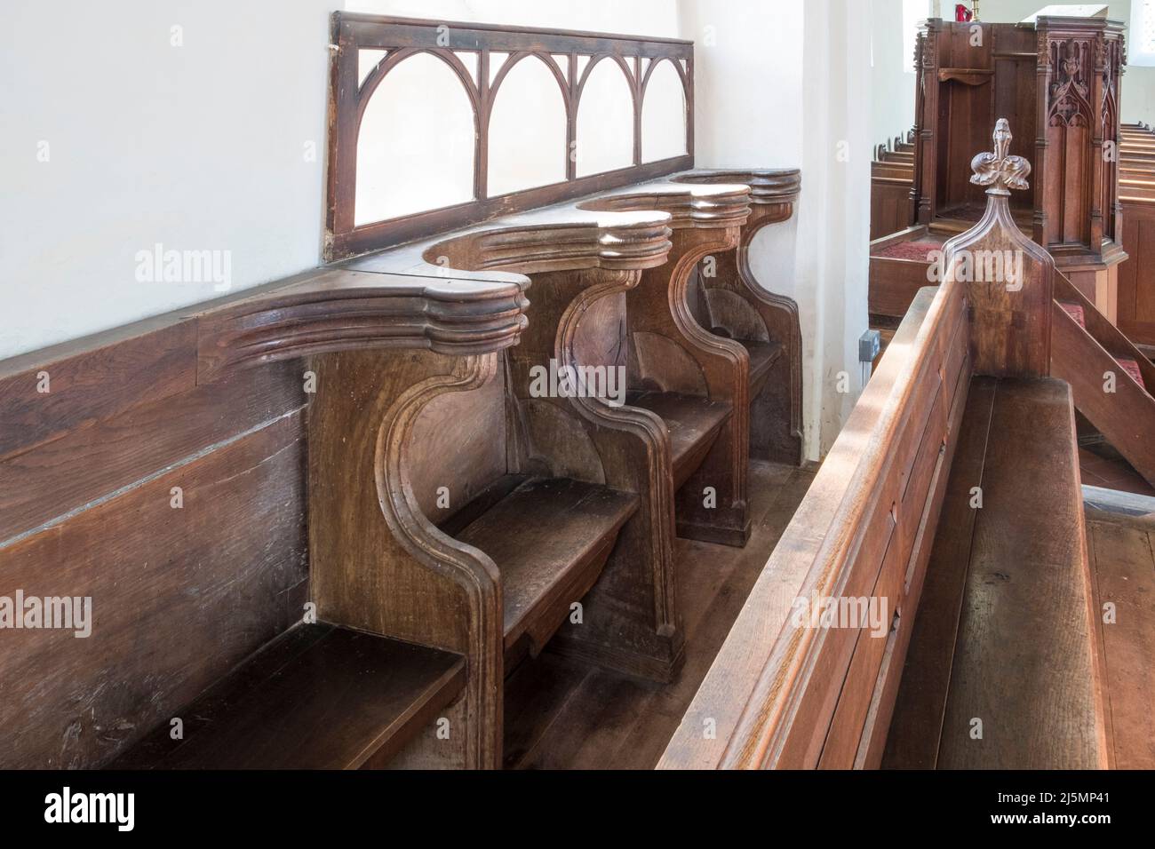 Miserichord seats in St John the Baptist church, Denham, Suffolk, UK. Stock Photo