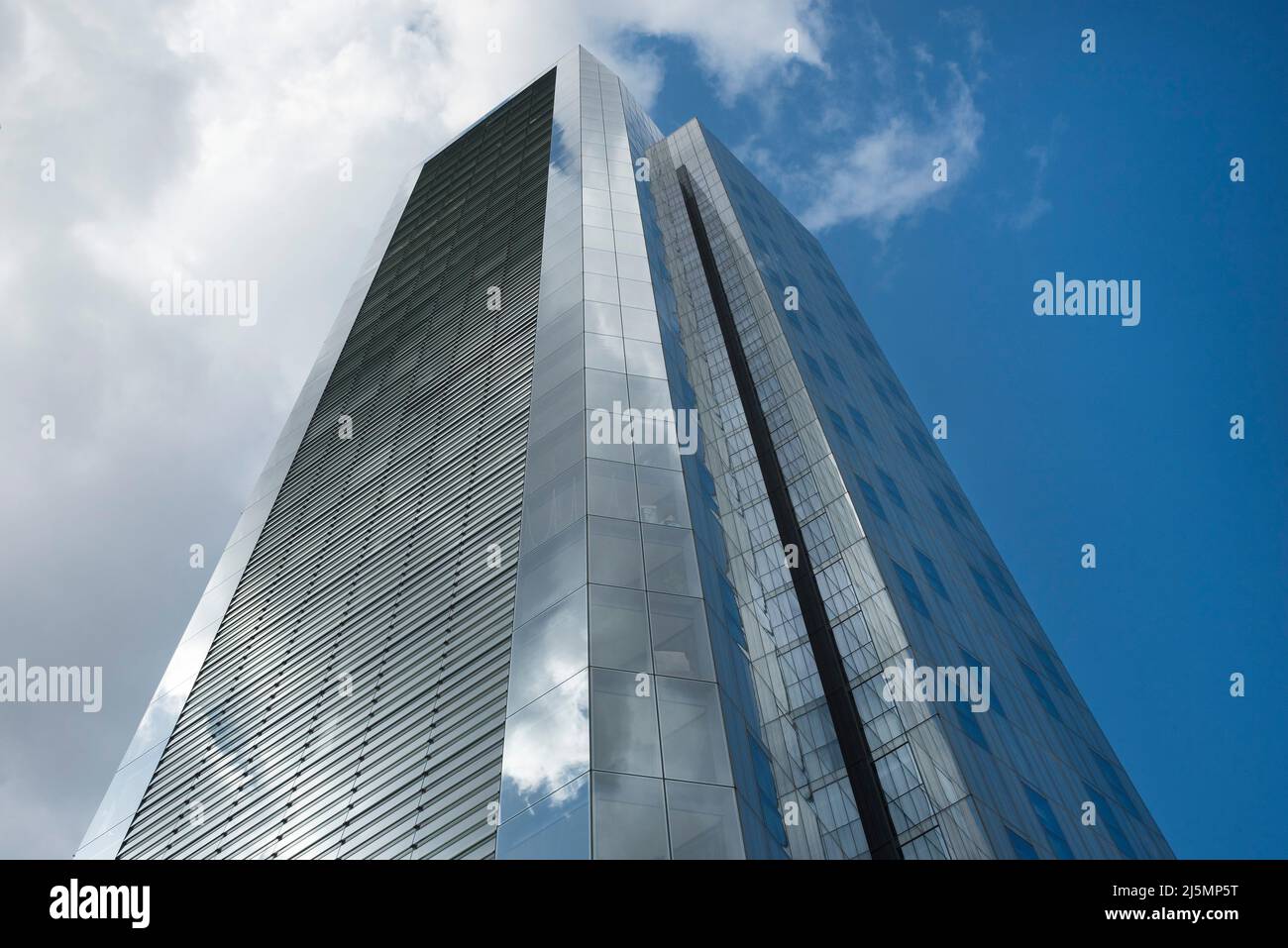 Modern urban architecture: Residential tower block clad in glass with a facetted design and large louvred elevation in London. Stock Photo