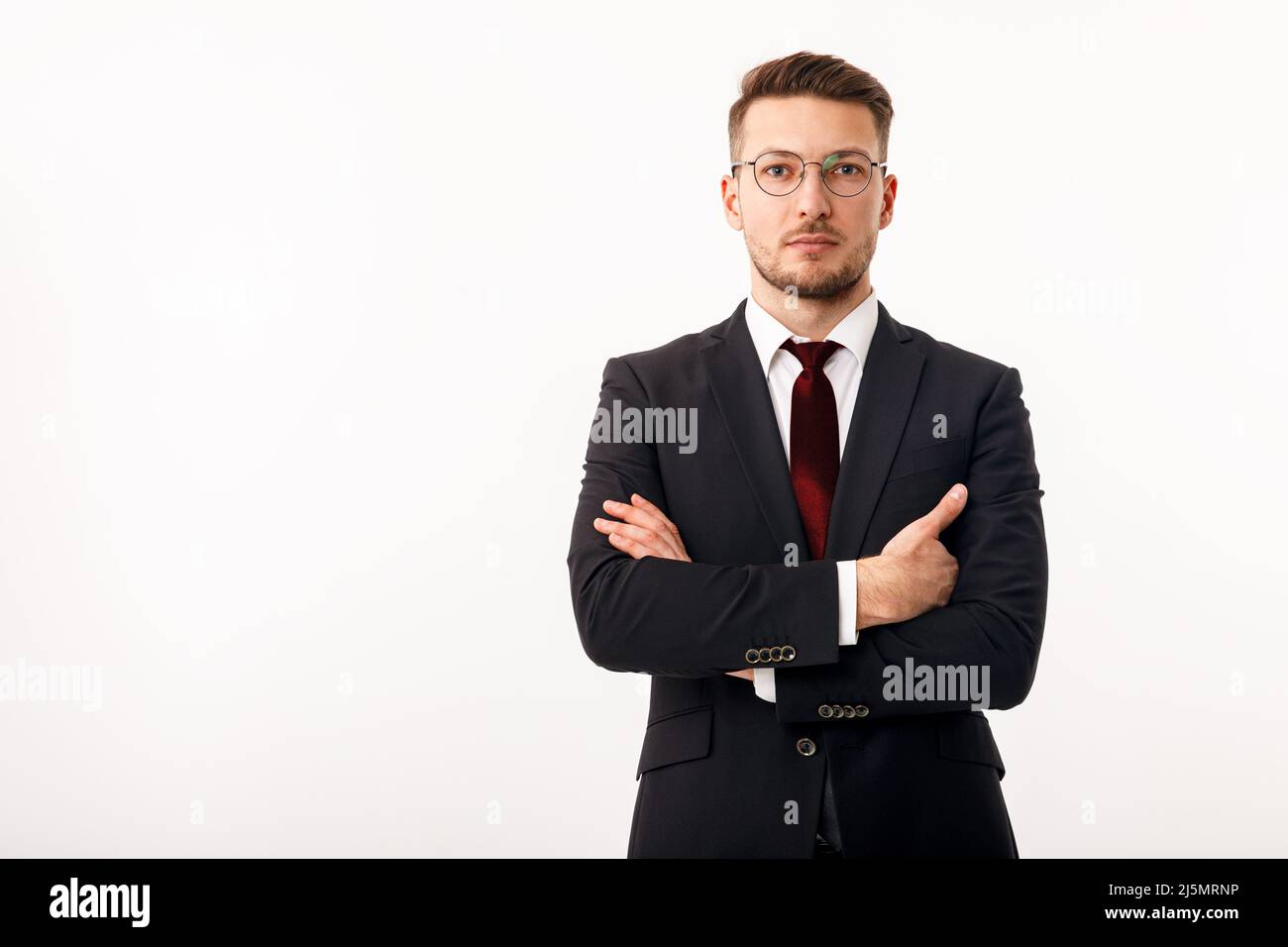 Portrait of a man in a business suit with a tie on a white background. Businessman on a white background. Stock Photo