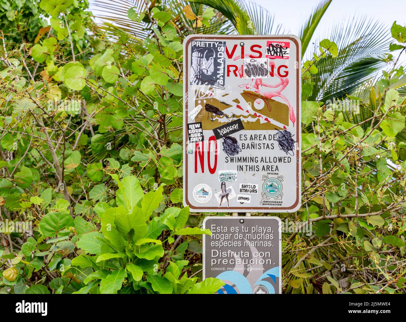 Vandalized signs at a Condado Beach in San Juan Stock Photo