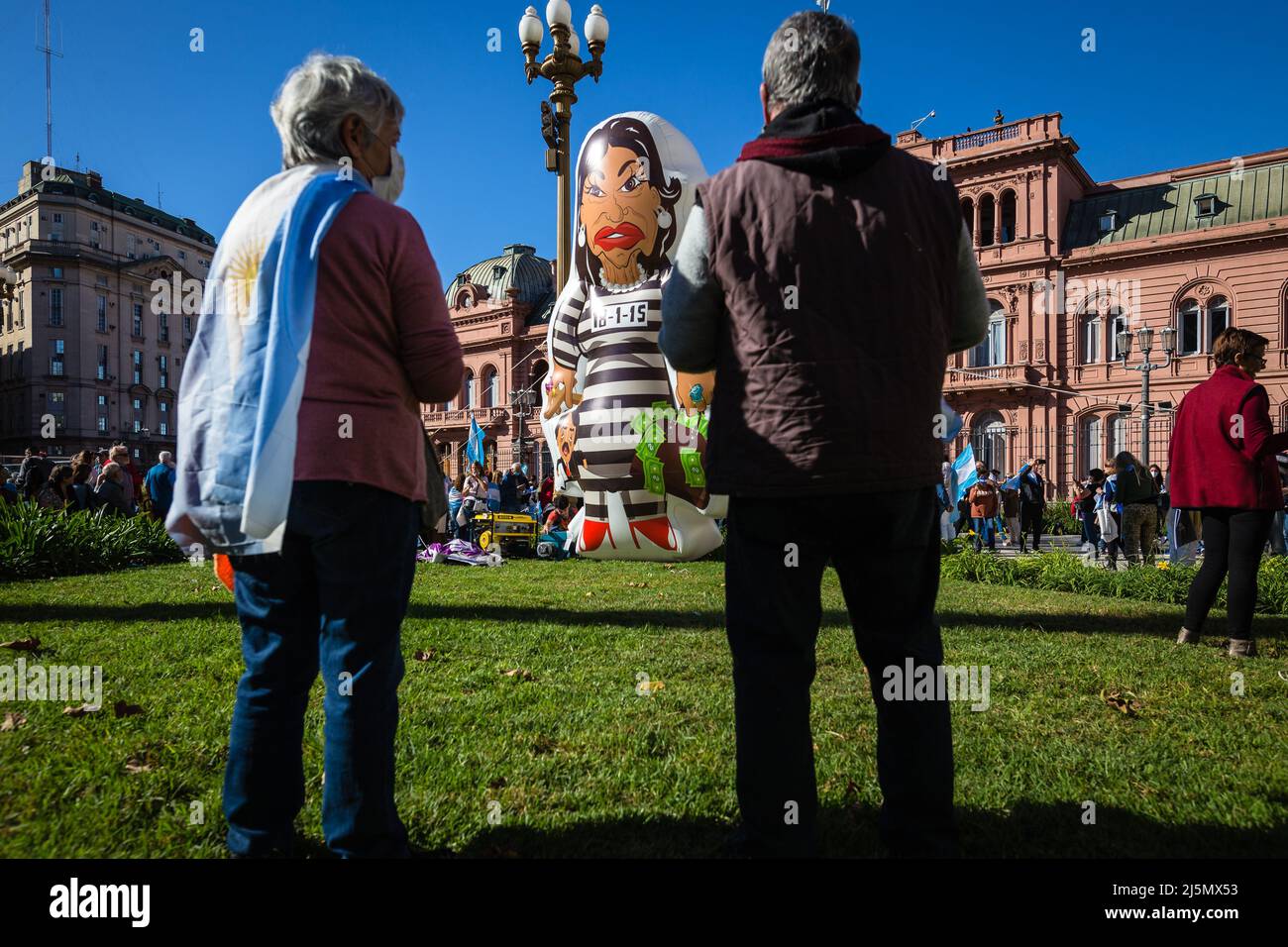 Buenos Aires, Argentina. 23rd Apr, 2022. Two demonstrators observe the puppet of Cristina Kirchner, vice president of Argentina, who refers to his judicial cases for corruption during the protest in the Mayo Square. The tractors of the Argentine rural producers were mobilized towards the Mayo Square, in Buenos Aires, to protest against the tax pressure that the Argentine countryside is consuming and the intervention by the National Government in the grain and meat market. Credit: SOPA Images Limited/Alamy Live News Stock Photo