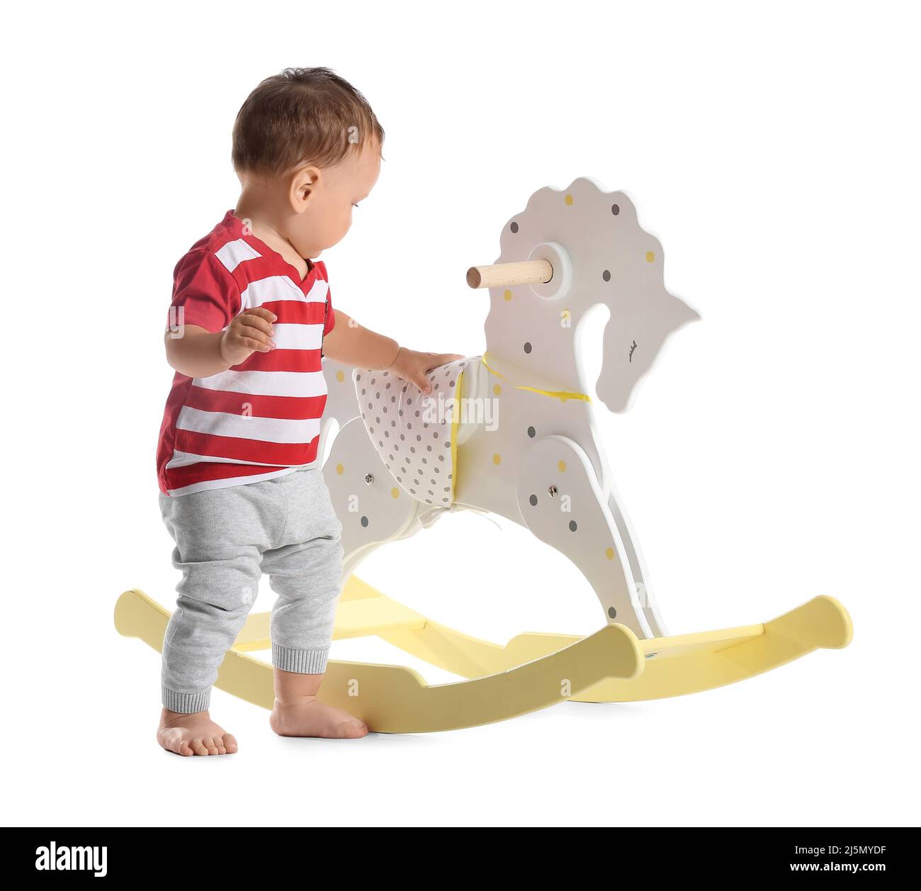 Little baby boy with rocking horse on white background Stock Photo - Alamy