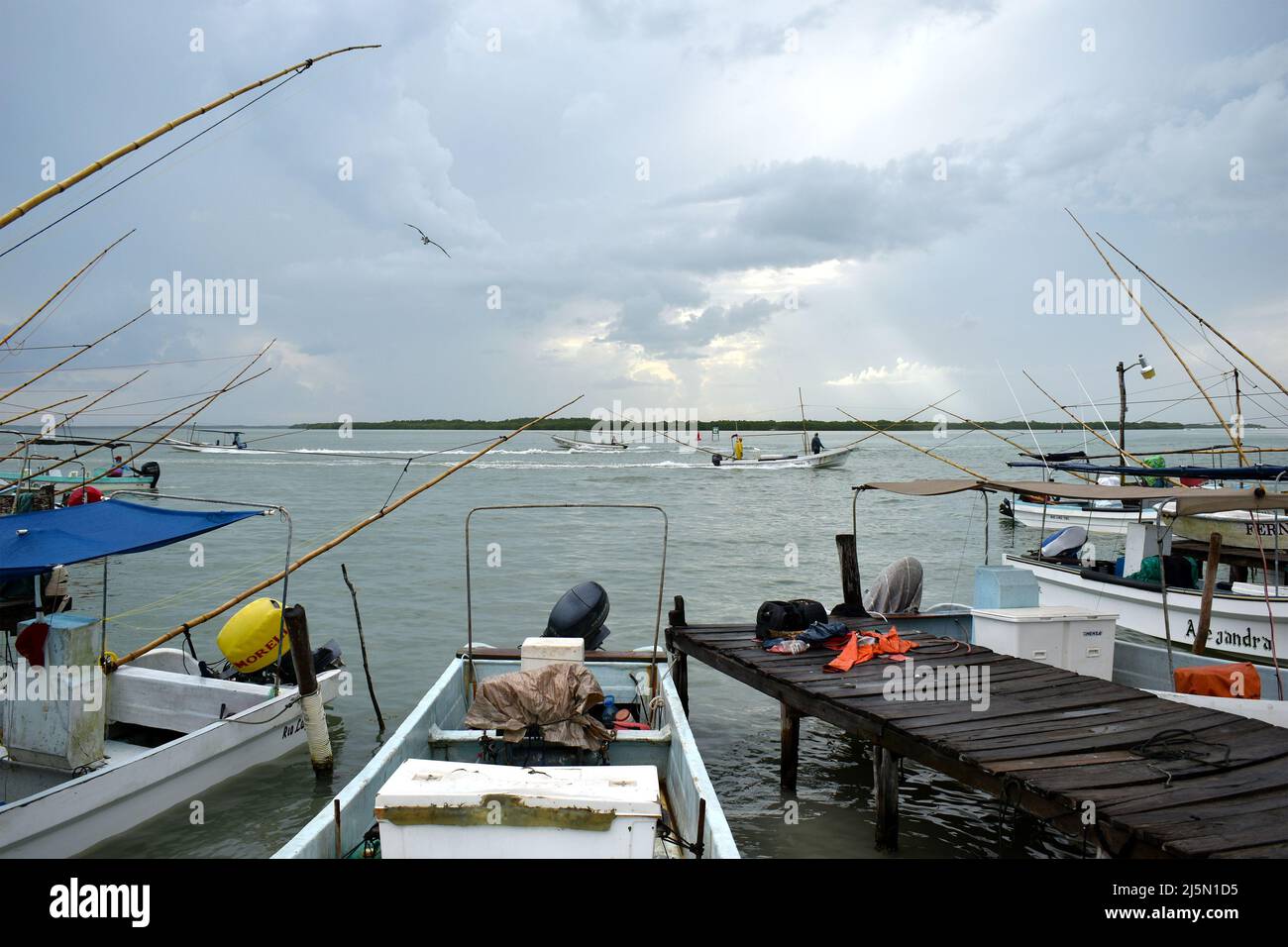 Rio Lagartos, Mexico - September 8, 2021: Fishing boats anchor on the shore outside the village of Rio Lagartos on the northern Yucatán Peninsula, Mexico Stock Photo