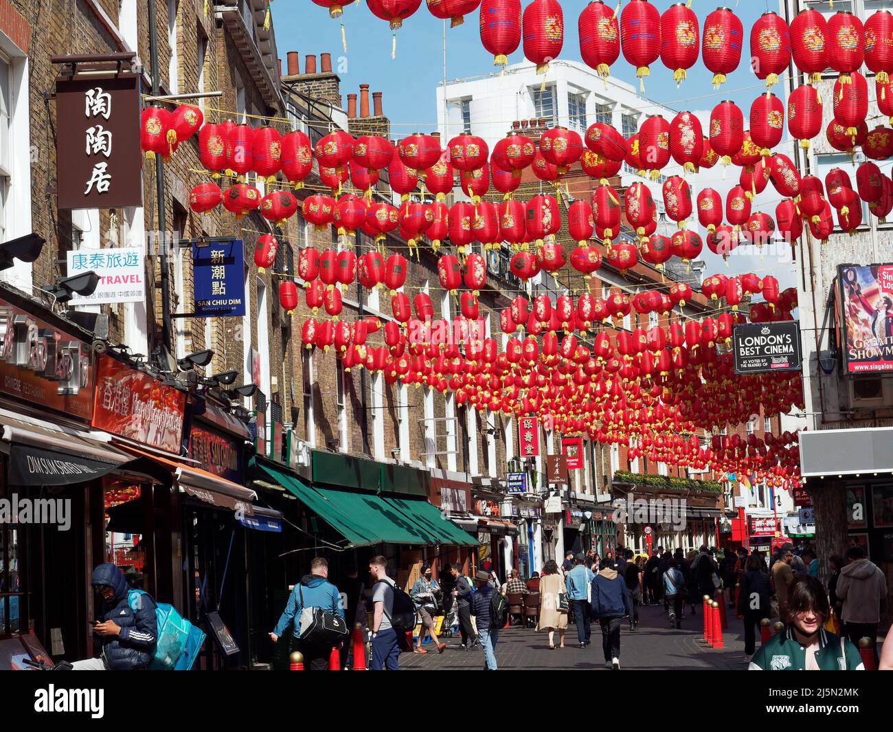 A view along LisleStreet in London's Chinatown decorated with hanging red lanterns Stock Photo