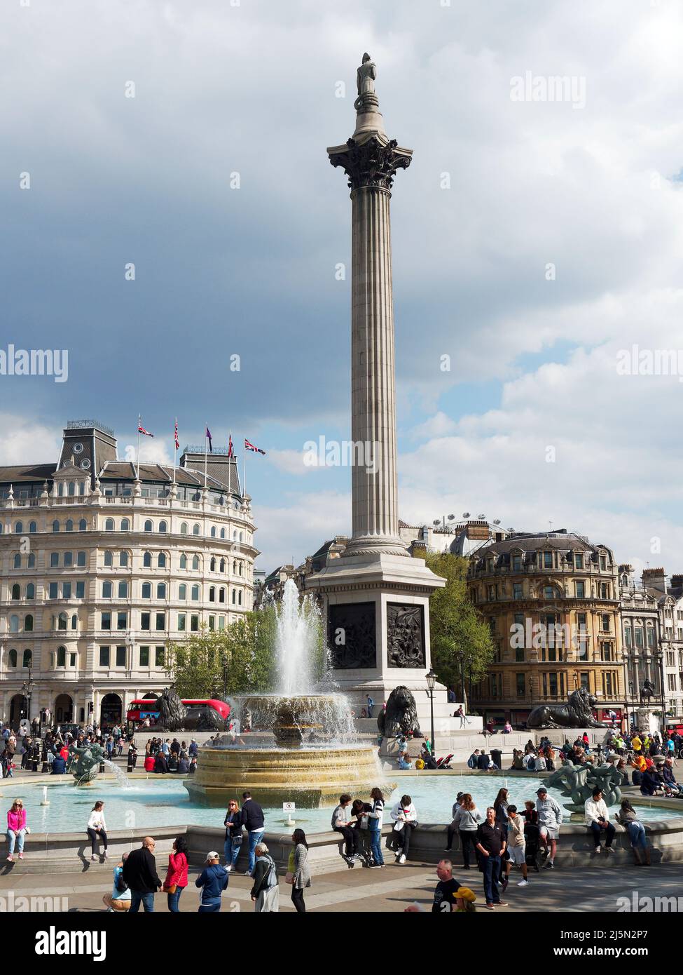 View of Nelson's Column in the middle of Trafalgar Square in London on a bright Spring day Stock Photo