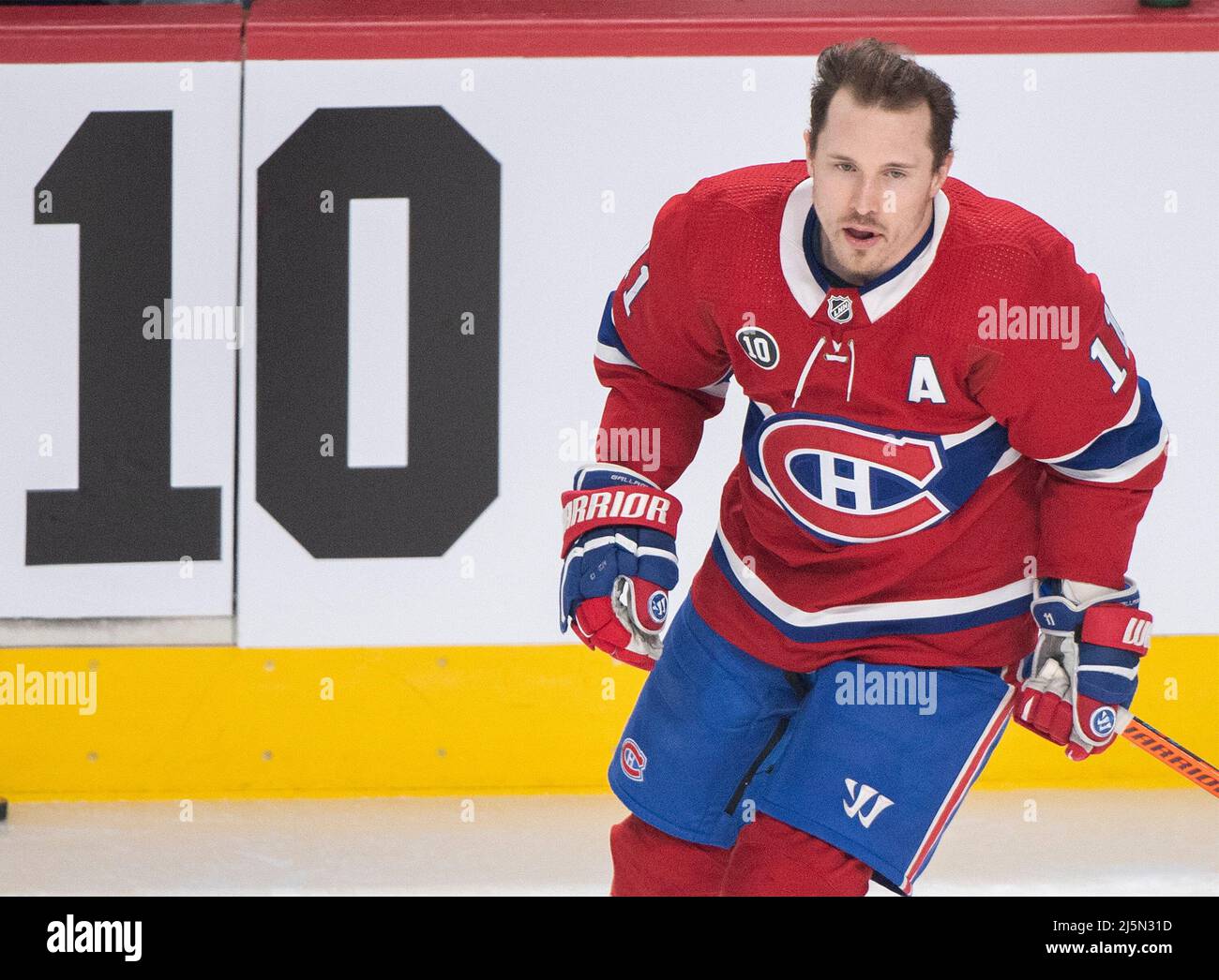 Montreal Canadiens Brendan Gallagher wears a 10 on his jersey in memory of Guy Lafleur prior to an NHL hockey game between the Canadiens and Boston Bruins in Montreal Sunday April 24