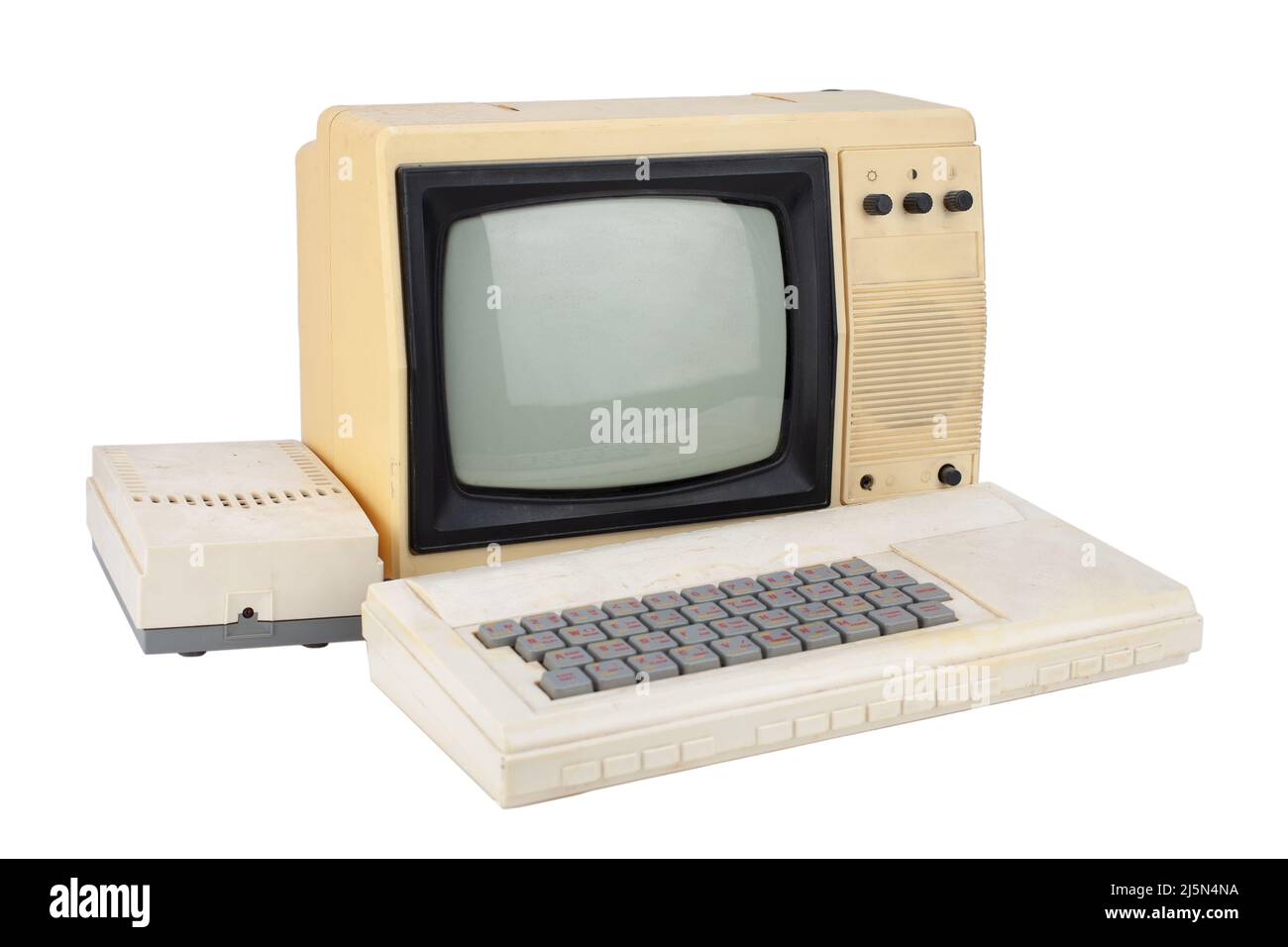 old 8 bit computer with monitor from tv set isolated on white Stock Photo