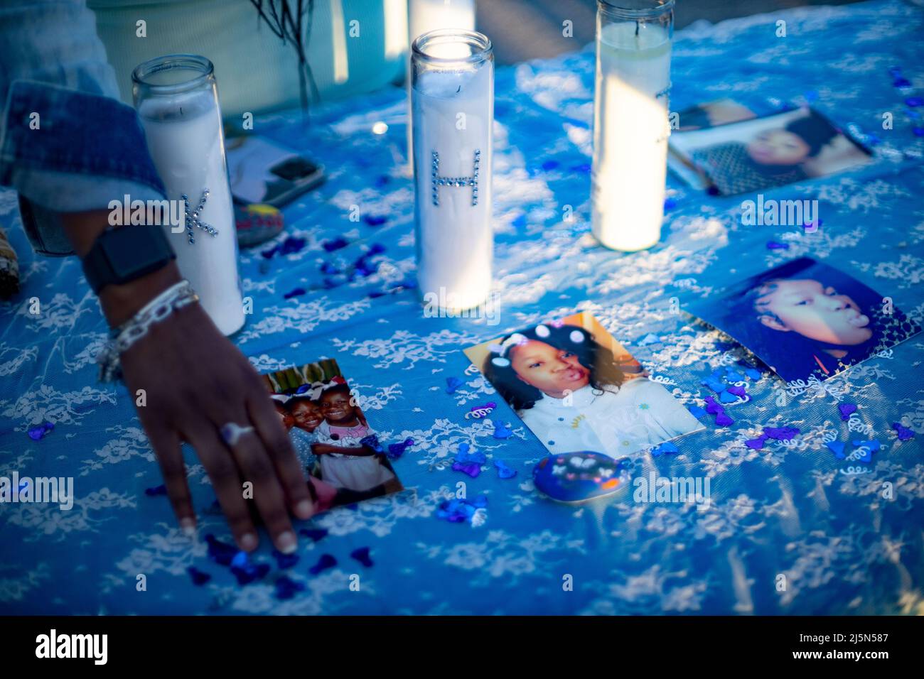 Table with pictures of Ma'Khia Bryant and candles spelling out Bryant's name at the Community Vigil for Ma'Khia Bryant a year after the shooting. A candlelight vigil and memorial was held for Ma'Khia Bryant at Mayme Moore Park in Columbus, Ohio one year after Bryant was shot and killed by Columbus Police at the age of 16 years old on Saturday April 23, 2022. Ma'Khia Bryant's sisters Azariah Bryant, 14, and Ja'Niah Bryant, 16, appeared along with their grandmother, Jeanene Hammonds, and their aunt, Myra Duke. (Photo by Stephen Zenner/SOPA Images/Sipa USA) Stock Photo