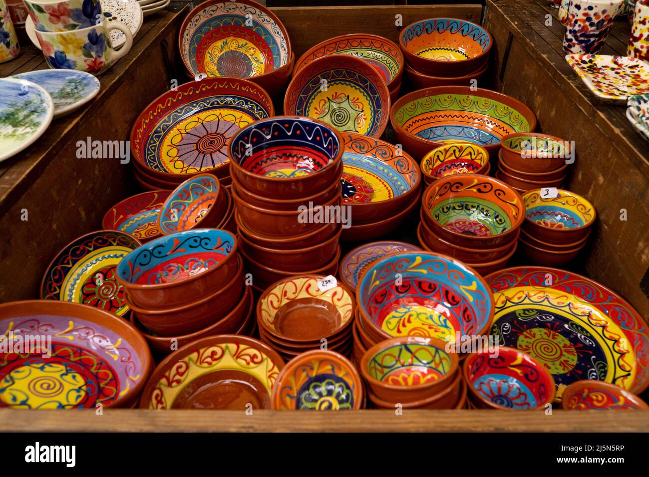 colorful dishes at a medieval market stall Stock Photo - Alamy