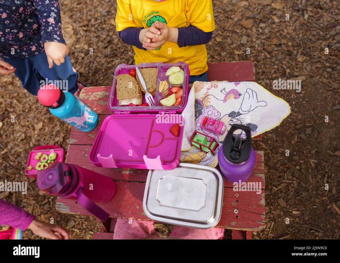 13 April 2022, Hessen, Büdingen: Children spread out the breakfast they