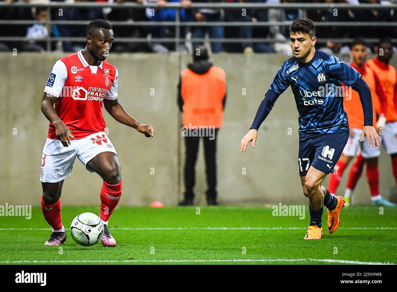 April 24, 2022, Reims, France: Ghislain KONAN of Reims and Cengiz UNDER of  Marseille during the French championship Ligue 1 football match between  Stade de Reims and Olympique de Marseille on April